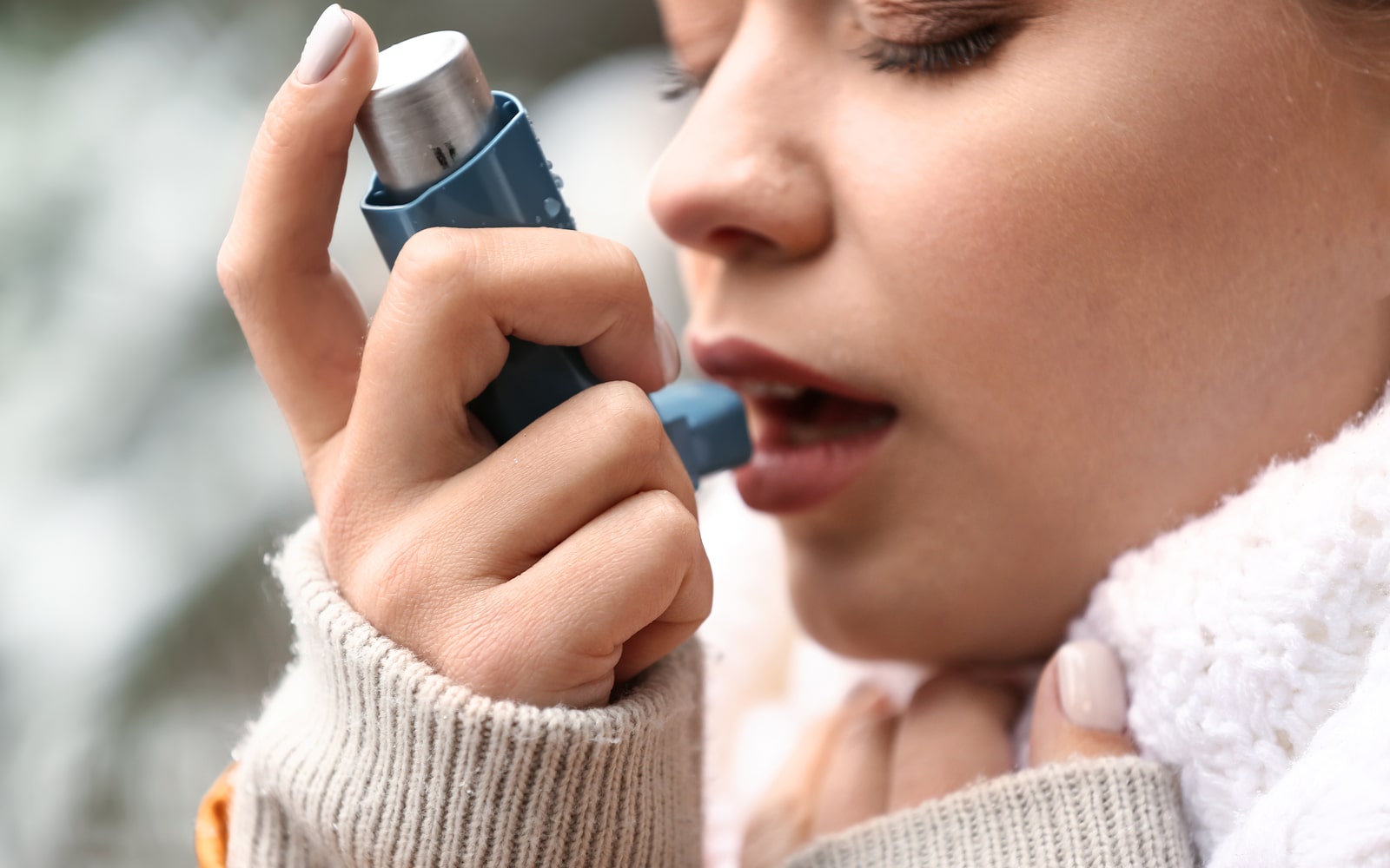 Asthma patient using inhaler